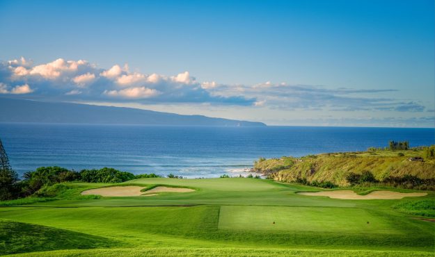 Hole 11 at Kapalua Plantation Course with ocean in background